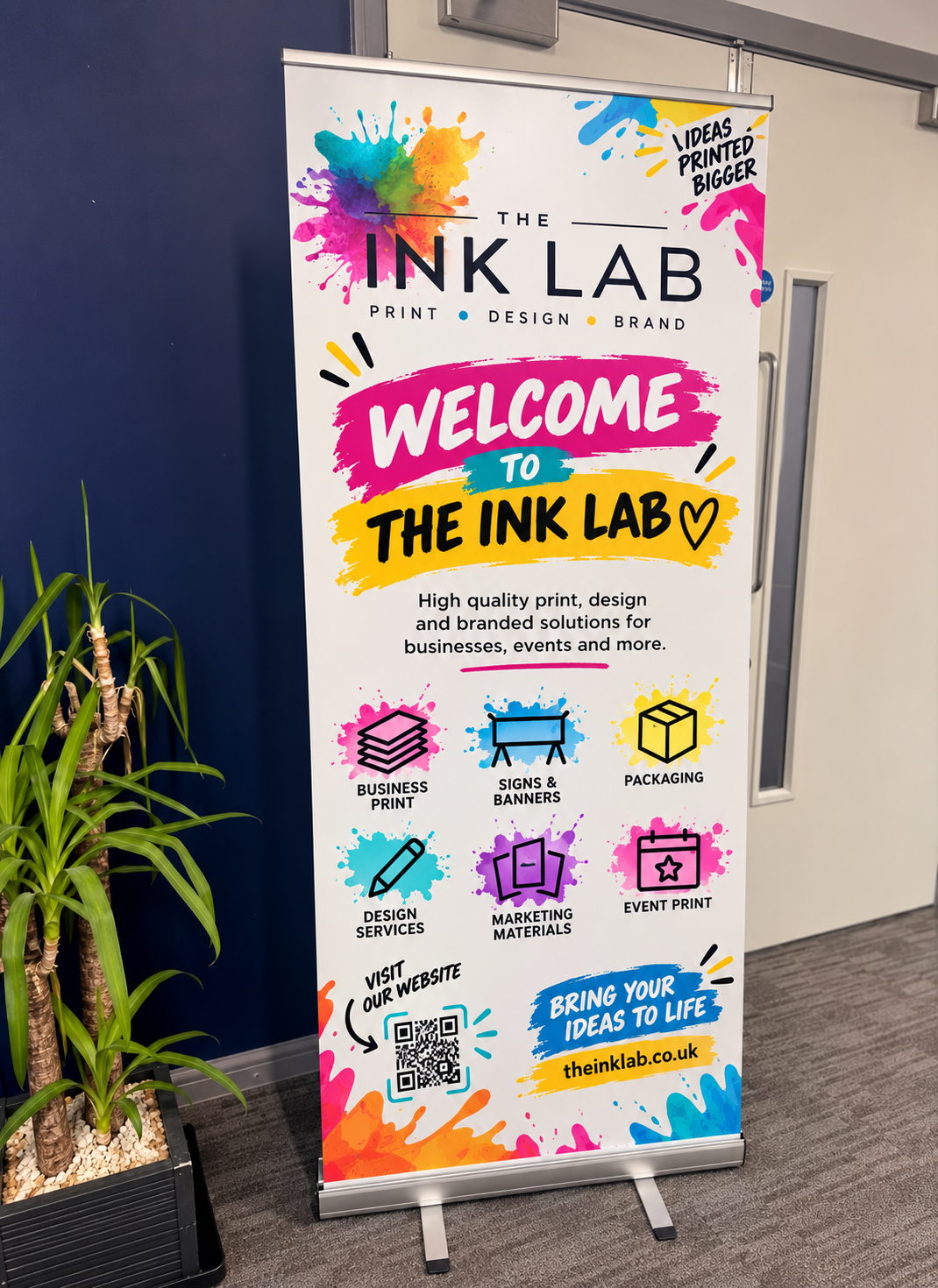 Premium roller banner displaying The Ink Lab’s colourful branding